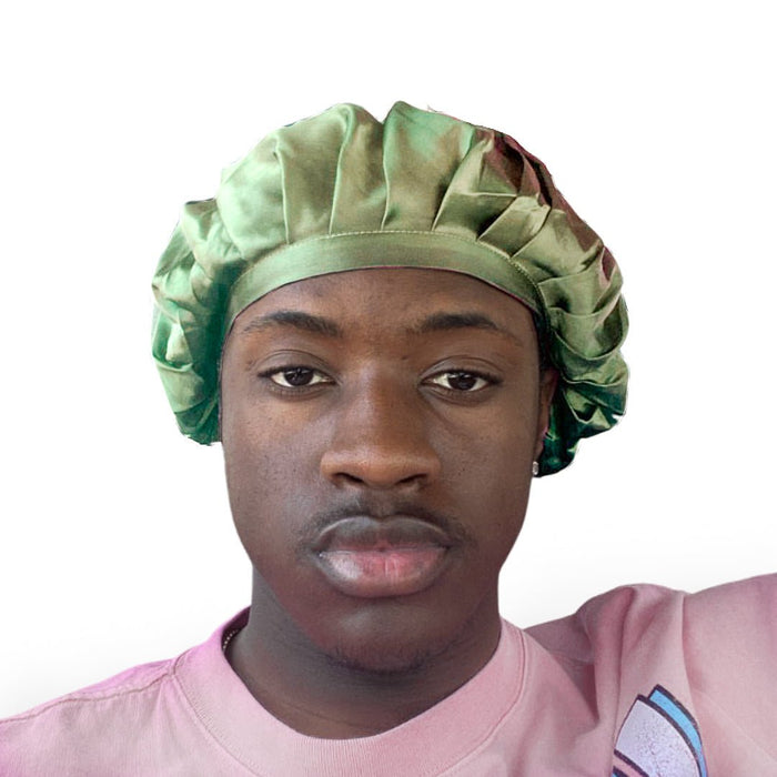 A man wearing a light green silk sleeping cap.